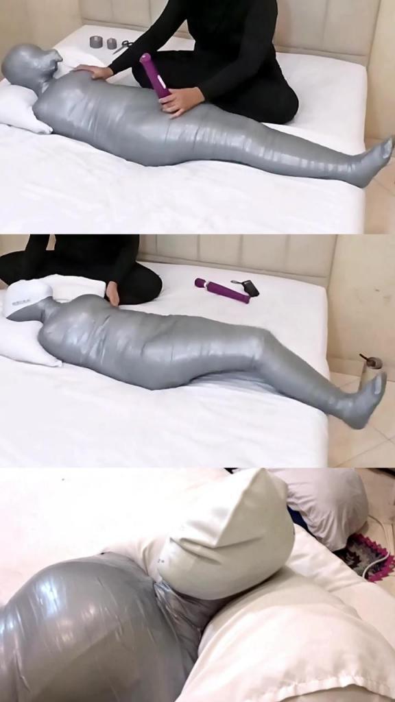 [POV] Main Scene Of RandyMummify RM150 A girl is wrapped into a mummy with white duct tape until her body is tight, then added with ash tape to make the girl move. After being helpless, this girl's body was toyed with and tortured by playing with her breath.