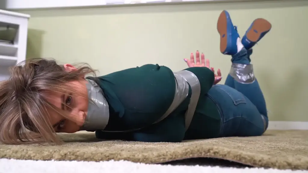 3046 Charlotte in Taped Up Takedown in a Turtleneck Charlotte wants some excitement/ How about a little tape time! Wrapgagged and taped up in her jeans and turtleneck t shirt. And its a Tuesday.