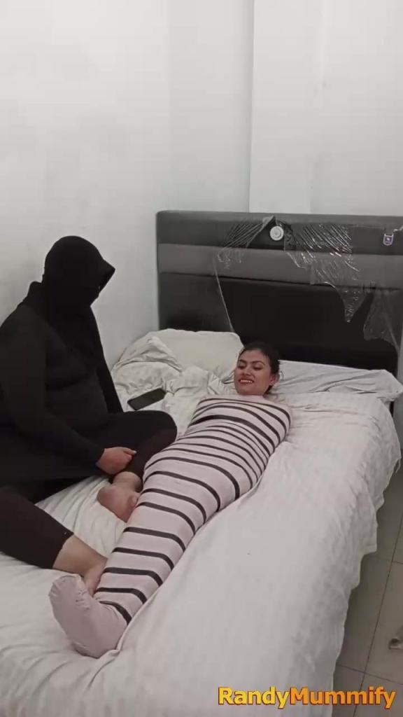 [POV] Main Scene Of RandyMummify RM164 A girl of Turkish descent tries to be wrapped into a living mummy. For the first time he felt the sensation of helplessness in his mummy wrappings