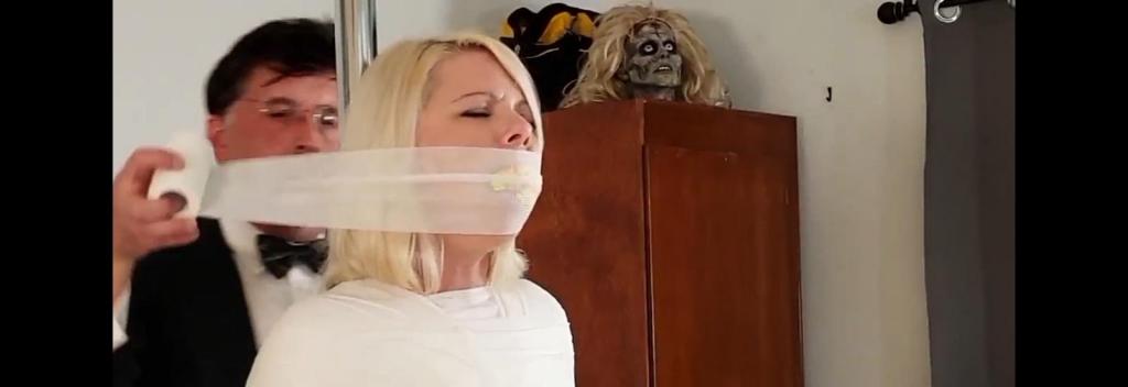 Jana White - Butler Binds and Mummifies Me With Breast Bondage and Nipple Clamps (MP4 Format) Jana White - Butler Binds and Mummifies Me With Breast Bondage and Nipple Clamps (MP4 Format)<br><br>Snooty young socialite Jana White treats her household staff with nothing but contempt, so when she felt a chill and berated her butler for not providing her with a wrap for the evening, he gave her EXACTLY that! He mummified the bitchy little tart tightly to a pole<br><br> she wouldn't stop mouthing off, so he packed her mouth with sponge and wrapped her face tightly in medical bandage, sealing her mouth shut and fusing her head to the pole! Now that she was finally silent, the butler decided to discuss an increase in salary with her, but she seemed less than receptive to the idea. Perhaps she was having trouble focusing on her plight, so the butler decided to give her something to think about! Using white electrical tape, he wrapped her huge boobs up so tight Jana thought they would explode! Squirming and mewling, the lady of the house was in absolute agony as her tits throbbed with pain! Finally, the butler realized he was be better off seeking other employment. Before he left, however, he clamped his former mistresses nipples, each clamp complete with it's own tiny bell! Now Jana was in dire straits indeed! However, if she jiggled her aching breasts hard enough, she just might be able to ring the bells loud enough to summon another member of the staff. Of course, who knew what they'd do to her if and when they came?<br><br>