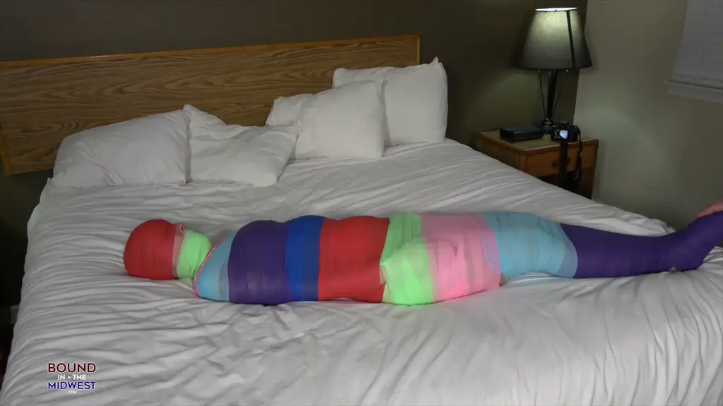 Rachel Adams Rainbow Mummification Rachel joins us just wearing for sexy vintage lingerie. Ready to be all wrapped up. we layer her from her ankles all the up to the top of her head. with many different colored vet wrap bandages. 