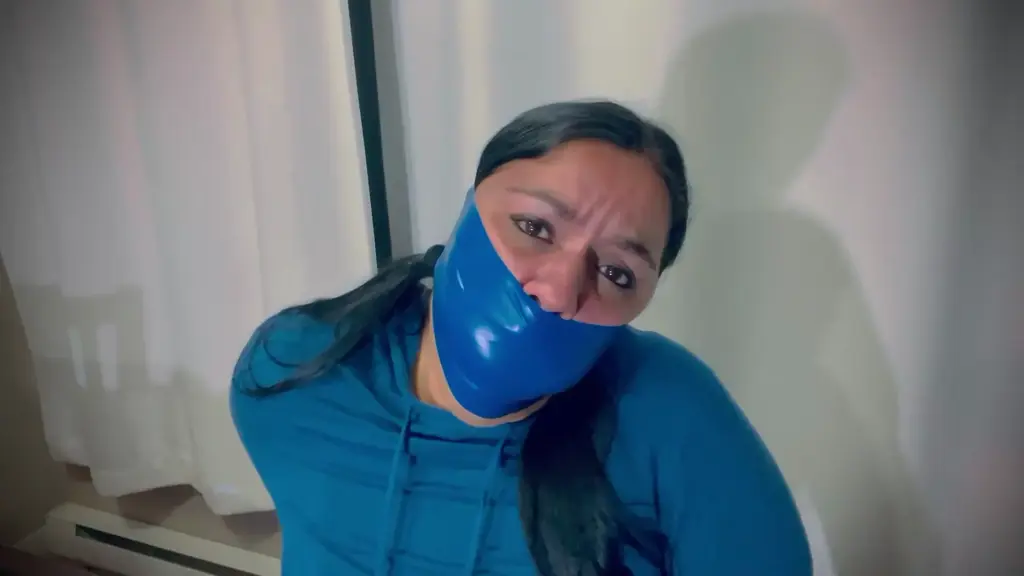 Now that’s what I call a gag 37 I do two simple gags in this video, both with extremely sticky pvc tape. For the first I cram 4 socks into my mouth then sealing them in tightly with white pvc. After removing the gag I proceed to seal in two balls and two thong’s proceeding to seal them in with a tight  blue pvc tape wrap.