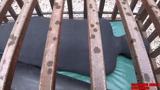 Rubber Cocoon Test 【中文乳胶男M】两位木乃伊在铁笼里从白天躺到晚上。Just a reminder you guys, I'm working on moving all the videos from this website to a new server and content management system. This new system will scale the screen size to display on Phones, Tablets, laptops, and desktop PC's. The changeover to the new platform will happen later this year, so stay tuned.<br><br>The video in this update features a new heavy rubber molded cocoon sack that we shot at in Las Vegas. This new sack is very exciting because it's super heavy latex rubber, one piece, with a zipper running up the back. This sack is from ForFun.store (an unusual URL) in Bangkok, Thailand. Thailand is a major producer and exporter of natural latex around the world. Natural latex is made from the sap of rubber trees, whereas tires and other industrial rubber products are made from petroleum. You can tell the difference by the smell, which is why serious rubber enthusiasts always smell the rubber.<br><br>Our friend Bind ordered this heavy sack, and it took one year for it to be delivered to him. Hopefully their delivery time is faster these days. I tried the sack myself, and it's very exciting indeed. I'm unclear if ForFun accepts custom orders. Bind gave them his measurements, but the sack seems tight around the leg calves, so I'm not sure how custom it really is. In addition, the sack doesn't come with arm sleeves unless you ask for them. As you will see in the video, the arm sleeves were a bit tight for Bind, and could have been made with heavier rubber.
