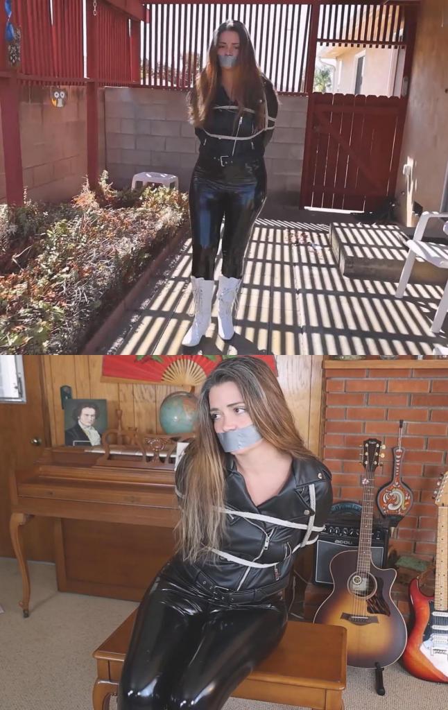 Ava May is a bounty hunter wearing all leather who gets captured, tied and gagged 艾娃·梅是一位身着全套皮衣的赏金猎人，她被抓获后，被绳子捆绑，嘴巴也被胶带封住。她挣扎时，皮衣发出悦耳的断裂声！Ava May is a bounty hunter wearing all leather who gets captured, tied with rope and tape gagged. Lovely sound of the leather cracking while she struggles!