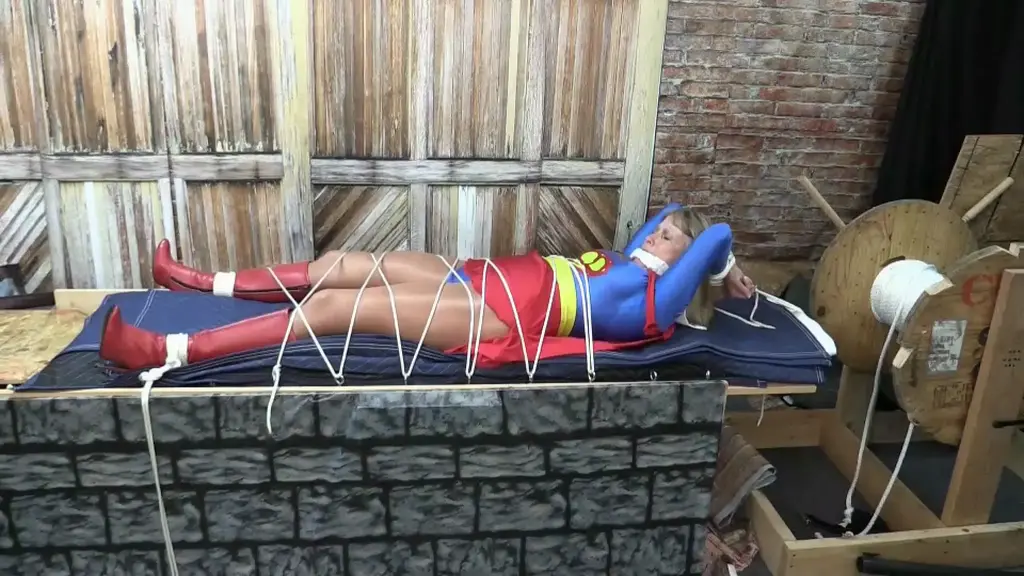 Super-Becca by JB Our heroine lies boun d and gagged, slowly moving towards the dangerous saw.