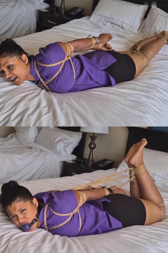 Calisa Bliss sassy masseuse says not that kind of massage 卡莉莎是一位非常出色的演员，在我看来，她最精彩的部分就是展现她那傲娇又任性的一面。在这部影片中，她扮演一位按摩师，而她的顾客对“按摩”的理解却截然不同。<br><br>卡莉莎被绑在床上后，试图用甜言蜜语脱身。当绑匪拒绝放开她时，她立刻翻脸，变得傲慢无礼，甚至威胁说等她逃脱后要狠狠揍他们一顿。<br><br>即使卡莉莎被塞上了巨大的紫色口塞，并被五花大绑，她仍然一边发出含糊不清的声音，一边摆出一副桀骜不驯的样子，试图挣脱束缚。直到影片接近尾声时，她愤怒的呻吟才变成了绝望的呜咽，因为她意识到自己根本不可能靠自己逃脱。Calisa is such an incredible actress and, for me, she's at her best when she's able to lean more into her sassy and bratty side. She does that here when she plays a masseuse who's client has a very different idea about what a "massage" is.<br><br>Once Calisa is tied on the bed, she tries to charm her way out of the situation. After her captor refuses to let her go, she instantly flips, getting sassy and even threatens to kick their ass when she gets out.<br><br>Even once Calisa has been gagged with the huge mouth filling purple gag, and hogtied as well, she continues to gag talk and give attitude while attempting to get free. Only towards the end of the video do her angry moans become desperate whimpers, when she realises that there's no way she's getting out of this by herself.