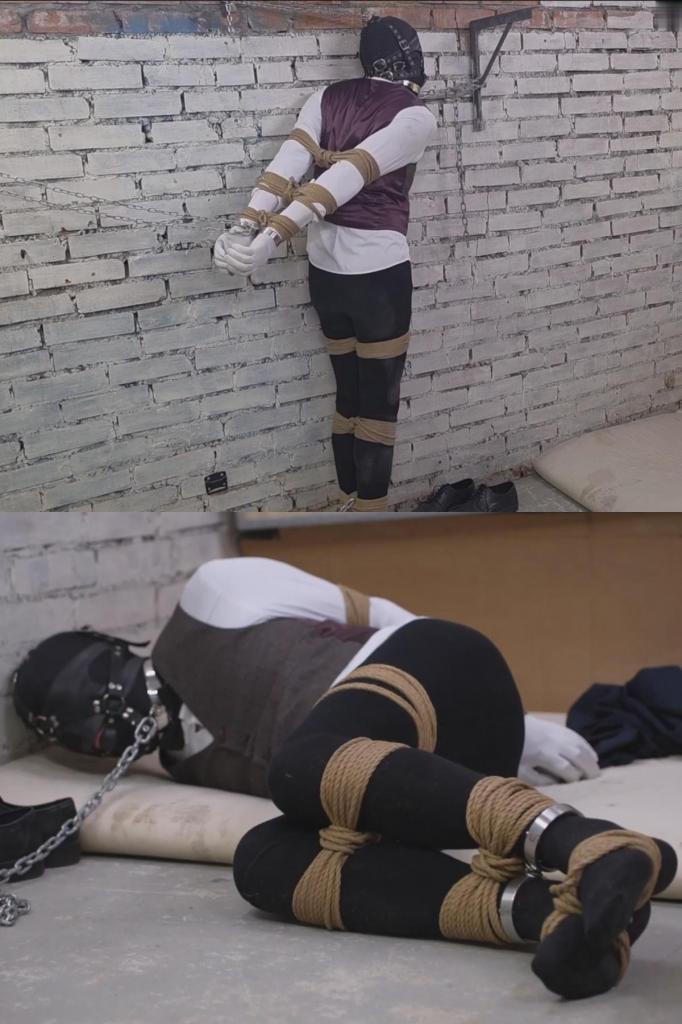 Escape from her basement 他整日辛勤劳作，不遗余力地满足着严厉女主人的每一个心愿。作为奖励，她决定让她的贴身男奴稍作“休息”。<br><br>他被粗糙的绳索捆绑得动弹不得，手腕和脚踝上戴着沉重的金属镣铐，头上罩着厚厚的、密不透风的头罩，嘴里塞着紧紧的口塞，躺在铺在冰冷地下室水泥地上的一张薄薄的床垫上。连接在他项圈上的沉重铁链牢牢地锁在地板上的一个钢环上。女主人自信地走开了，留下他独自一人置身于漆黑寂静之中。她无比平静——他哪儿也去不了。<br><br>然而，这个奴隶早已暗中策划着逃跑。<br><br>他费尽九牛二虎之力，用藏起来的备用钥匙打开了锁链。他的心脏怦怦直跳。他无法解开绳索、镣铐和头罩，只能盲目地在地下室里爬行，拼命寻找出路……<br><br>突然，他的路被堵住了。<br><br>是她。<br><br>休息时间瞬间结束。原本的床垫被冰冷的地下室墙壁、锁链和极其难受的站姿所取代。女主人用锁链将他紧紧束缚，让他以这种令人精疲力竭、痛苦不堪的姿势站着。<br><br>没有逃脱的机会。<br><br>找不到舒服的姿势。<br><br>只有无助的挣扎、被堵住嘴的呜咽和彻底的屈服。<br><br>惩罚会持续多久？<br><br>很久。<br><br>非常久。He worked all day long, sparing no effort, fulfilling every whim of his strict Mistress. As a reward, she decided to give her personal slave-servant a little “rest”.<br><br>Bound with rough ropes to complete helplessness, in heavy metal shackles on his wrists and ankles, wearing a thick impenetrable hood over his head and a tight gag stuffed deep into his mouth, he lies on a thin mattress thrown directly onto the cold concrete floor of the basement. The heavy chain attached to his collar is securely locked to a steel ring in the floor. The Mistress confidently walks away, leaving him alone in complete darkness and silence. She is absolutely calm — he isn’t going anywhere.<br><br>But the slave has been secretly planning his escape for a long time.<br><br>With enormous effort, using a hidden spare set of keys, he manages to unlock the chain from the floor ring. His heart is pounding. He can’t remove the ropes, shackles, or hood, but he begins to crawl blindly across the basement, desperately searching for a way out…<br><br>Suddenly, his path is blocked.<br><br>It’s Her.<br><br>Rest time is over instantly. Instead of the mattress, there is now the cold basement wall, chains, and a very uncomfortable standing position. The Mistress secures him tightly with chains, leaving him standing in this exhausting, agonizing pose.<br><br>No chance to escape.<br><br>No chance to find a comfortable position.<br><br>Only helpless struggling, muffled moans through the gag, and total surrender.<br><br>How long will the punishment last?<br><br>A long time.<br><br>A very long time.