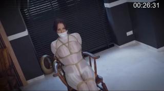 Chair bondage predicament – Struggling against tight ropes and a leather strap gag Chair bondage predicament – Struggling against tight ropes and a leather strap gag