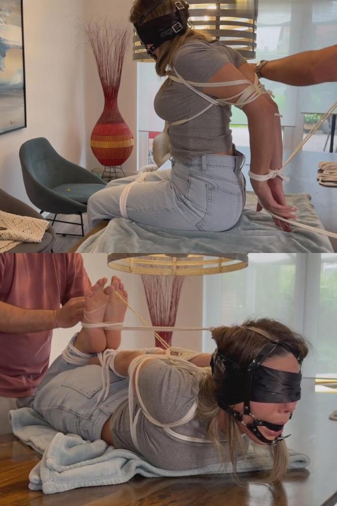 young pretty woman gets Tight hogtie 今天体验了全套服务。先说明一下：因为是在别人家拍摄，所以有点赶时间——如果我嘴里的口塞没戴正，请见谅；他没注意到。我被绑成一个非常紧的猪蹄式，试了试我的新口塞。我的胳膊、躯干和腿都被紧紧地绑住了。然后他收紧了捆绑，脱掉我的鞋子——露出我脏兮兮的白袜子——接着绑住我的大脚趾，把我的头和脚连在一起。我毫无反抗之力。The full treatment today. Just a heads-up: we were a bit rushed since we were filming in someone else's house—so apologies if the gag isn't sitting quite right on my chin; he didn't notice. I get bound in a complete, very tight hogtie and test out my new harness gag. My arms and torso are strapped down tight, and my legs are too. Then he cinches the hogtie, pulls off my shoes—revealing my dirty white socks—and proceeds to tie up my big toes and connect my head to my feet. I don't stand a chance.