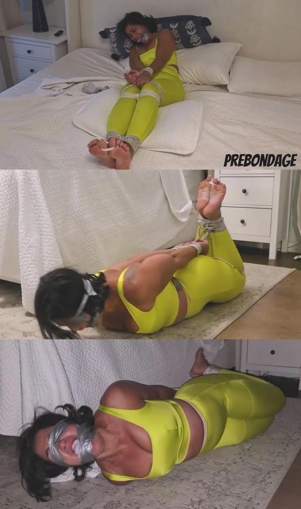 Sahrye's Postworkout Robbery 萨瑞刚刚结束了一场漫长而艰苦的锻炼。她穿着紧身的瑜伽运动裤、紧身运动内衣、及踝袜和运动鞋。她一边脱鞋一边慢慢地在床上躺下……“哎哟，我的脚又臭又湿。”她决定放松一下，睡个午觉。她跳起来，关掉灯，扑到床上。<br><br>过了一会儿，趁她午睡的时候，我偷偷溜了进去，一把抓住……她还没反应过来，就被我紧紧地绑了起来，她那双漂亮的脚也暴露无遗。<br><br>她坐在床上，双手被绑在身前，绑在大腿上，膝盖也被绑在一起，双脚被抬了起来。她看着我走进来，立刻生气地问：“你在这里干什么？”“你为什么要这么做？”我慢慢地一双一双地脱掉她的运动袜，露出她漂亮的脚底。然后我把袜子扔到她腿上，把她的脚踝绑在一起，最后绑住了她的脚趾。她越来越生气。<br><br>我把她的一只袜子在她面前晃来晃去，她抗议着说袜子又臭又脏。我把袜子塞进她嘴里，然后用胶带把她的嘴紧紧地缠了起来。她嘴巴被堵住后，我让她发出呜咽声，她挣扎着，嘴里发出愤怒的呜咽声……我走到她脚边，挠她痒痒，她抗议着。我挠了一会儿，她试图挣脱，但徒劳无功！现在我有了任务……那就是把她洗劫一空，让她独自一人在床上挣扎！<br><br>洗劫完毕后，在我离开之前，我又给她缠了一遍胶带，然后把她的眼睛蒙了两遍，甚至把她从床上拽下来，绑在地上，她挣扎得更厉害了。我关上门，把她留在黑暗中，她一边挣扎一边呻吟。Sahrye had just got done doing a long tough workout. Shes dressed in tight yoga workout pants, tight sports bra, ankle socks, and sneakers. Shes slowly gathering her self on the bed as she takes her shoes off... “oof my feet are sweaty and smelly”. She decides its time to relax and take a nap. She jumps up, turns off the light, and pounces into bed.<br><br>A little while later I sneak in while shes napping & grab...next thing she knows she bound up tightly with a great view of her precious feet.<br><br>Sitting on her bed, hands tied in front if her and tied to her thighs, her knees tied together, and he feet propped up. She watches me walk in and shes immediately angry asking "what are you doing here" and "why are you doing this". I slowly take off her workout socks one by one revealing her nice soles. Then I toss her socks to her lap & I tie her ankles together and eventually her toes. All this time she grows more and more angry.<br><br>I then dangle one of her socks in her face as she protests, saying its sweaty and smelly. I shove it in her mouth and then give her a tight layered duct tape wrap around gag. Once fully gagged, I let her mmmph and struggle as she moans and angry gag talks at me... I move to her feet and give her some tickles as she protests. As I tickle her a bit she tries to get free but to no avail! I now have a job to do...which is rob her blind so alone she struggles on her bed!<br><br>After Ive robbed the place, and before I leave, I give her another courtesy wrap around gag and then go over her eyes for a wrapped blindfold twice and I even pull her off the bed & hogtie her on the ground, and she struggles more. She struggles and moans as I close the door & leave her in the dark.