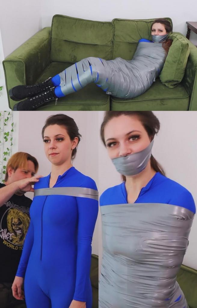 Mina wins a free bondage lesson! Mummified and tightly wraparound tape gagged 米娜·萨洛梅很喜欢她那本情趣月刊，有一天她寄出了一张优惠券，结果中了奖：一节免费的捆绑课程！她收到了一件蓝色紧身衣，非常合身，然后一位捆绑老师来到了她家。这节免费课程是木乃伊捆绑，所以米娜被用胶带捆成了木乃伊。捆绑老师往她嘴里塞了一双袜子，然后用一条巨大的胶带紧紧地封住了她的嘴！米娜挣扎着，呻吟着，享受着她的奖品！Mina Salome loves her fetish monthly magazine, one day she sent a coupon and she won a prize: a free bondage lesson! She received a blue bodysuit that fits perfectly on her, then a bondage teacher showed up at her home. The free lesson is mummification, so Mina gets mummified with duct tape. The bondage instructor stuffs a pair of socks in her mouth and then tightly gags her with a massive wraparound tape gag! Mina struggles, moans and enjoys her prize!<br><br> 