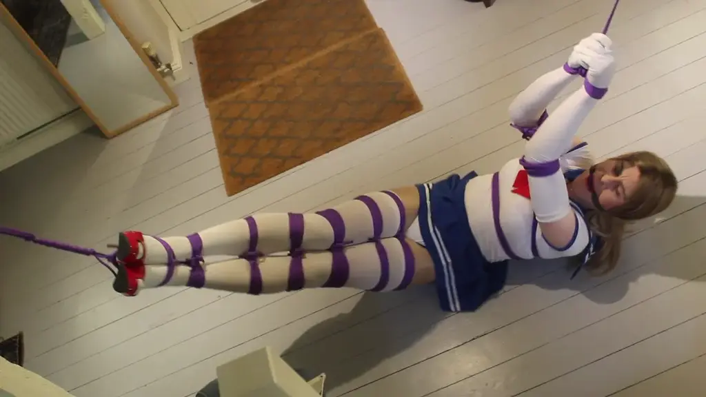 Sailor Moon Stretched Out and Suspended 伪娘<br>Part two of the Sailor Moon films see's Nina not only tied, gagged and stretched out with sexy purple ropes against her white skin tight costume but now her legs and arms have been pulled up and eventually she's fully suspended struggling still to get free as always 