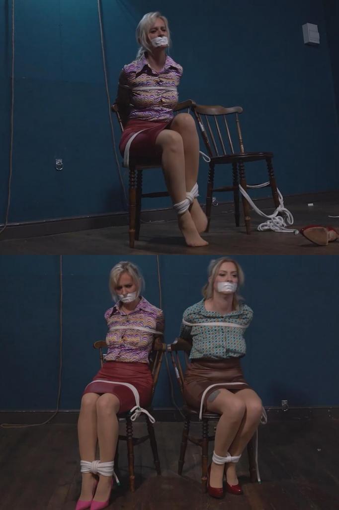 5273 Amber and Sandy in Blouse Chairties 桑迪和安珀已经被绑在椅子上了，我们只需要给她们戴上口塞。她们穿着办公室工作服，只需要绳子和一块微泡沫口塞就够了Already tied to the chairs, all we need to do is apply the gags to Sandy and Amber. Dressed in their office work clothes, ropes and a microfoam gag are all that are required.