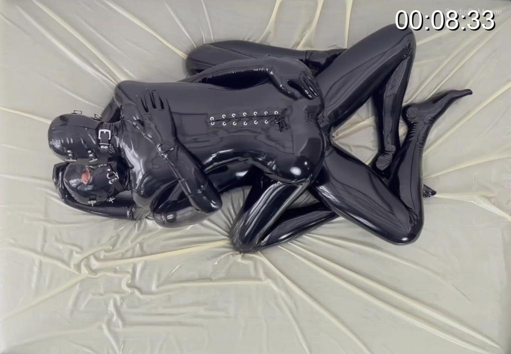 Mouth 2 Mouth Two rubber creatures laying in a bed of latex, drifting into their desires with a special double device ...<br><br>Watch how much the intensity rises and see them getting more and more turned on ...<br><br>(testing the Double-Gag-Harnish Didymos by moanspeak - bthw. we love it!) But see for yourself ...