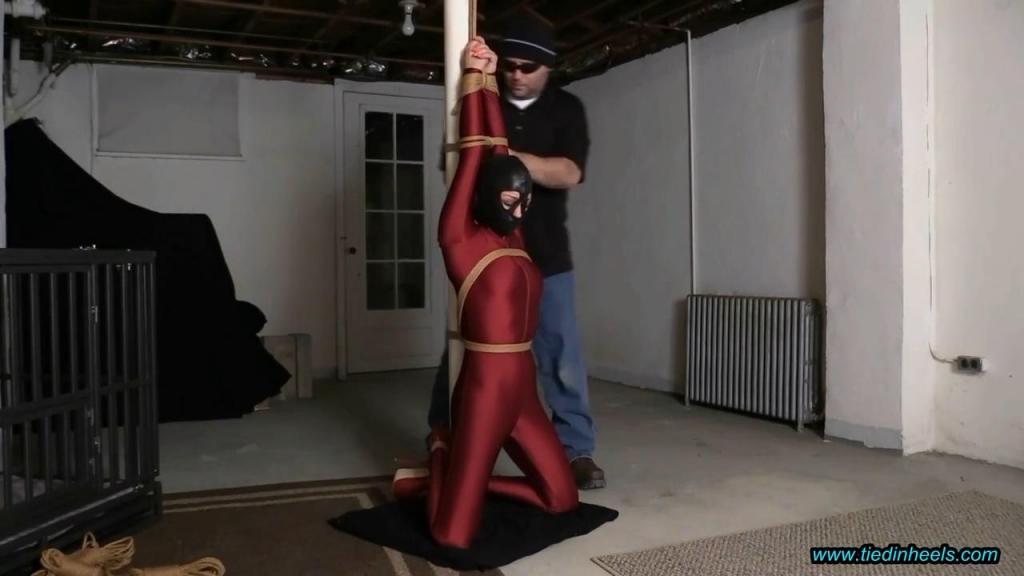 Sarah Brooke Hooded and Tormented in the Basement Dungeon!  Super SEXY Sarah Brooke makes her debut in the basement dungeon! Sweet Sarah consents to be hooded, bound and to orgasm as a prisoner in the basement dungeon! Sarah wears an incredible, body hugging spandex catsuit and skyscraper red patent leather high heels! Well, I immediately go to work on this beauty...she is fitted with a tight leather hood which enhances her beautiful eyes...then Sarah is tightly bound to the basement bondage post kneeling with her arms tightly secured overhead....this SEXY captive isn't going anywhere! Once Sarah is secured to the post<br><br>she is so helplessly and vulnerable, she has no choice but to submit to the pleasures of the basement dungeon! Sarah will make a fine additoon to the basement stable! <br><br>