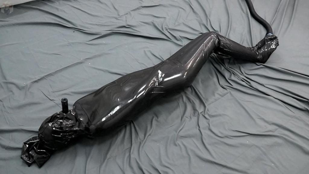 Bondage in a black vacuum cocoon Sonya is a girl of magic. But she is just learning this skill. She is not very good at transforming herself into someone else. This time she tried to reincarnate into a bat, but something went wrong and the girl got stuck in a black encasement...