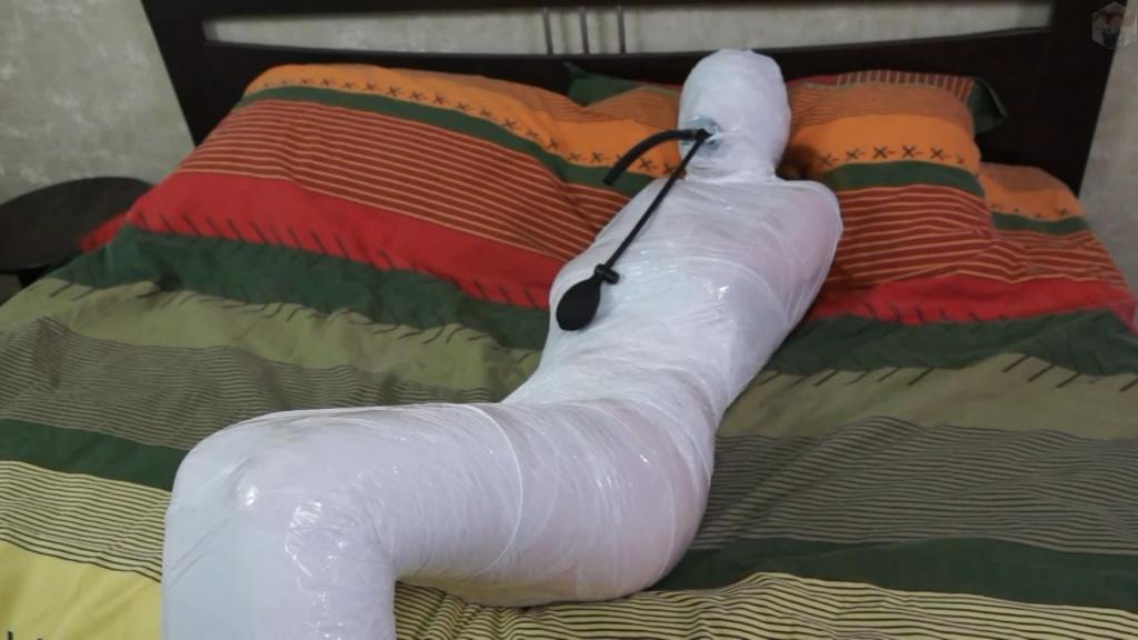 White stretch film for bondage and inflatable gag In case you've forgotten, this is a reminder that Sonya is a novice sorceress. She is learning how to turn into different and things. This time she tried to turn into white snow, but the transformation failed. See how it turned out...