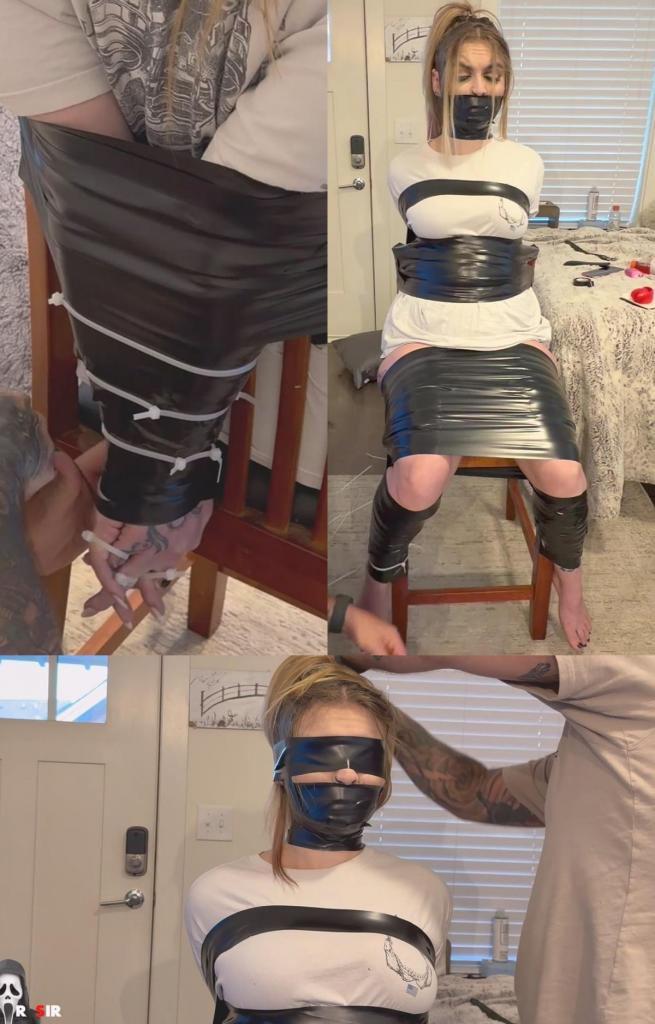 Perfect Posture Training 他知道凯特琳是个喜欢耍小聪明、想逃脱的小淘气，于是稍微加重了难度。<br><br>凯特琳会被用胶带绑在一把木椅上，双手反绑在身后，手腕一直绑到手肘。<br><br>她的上半身会被胶带完全包裹住，胸部向前挺出，阴茎也被牢牢固定住。<br><br>她的双腿也被紧紧地绑在一起，垂直固定得完美无缺。<br><br>她的大腿到膝盖也用同样的方法缠绕，臀部被牢牢地固定在椅子上。<br><br>然后，她又被塞上了无法挣脱的口塞（参见之前的视频片段）。她的舌头被塞进硅胶口塞里，嘴巴也被塞得满满的，让她只能发出含糊不清的呜咽声和呻吟声。<br><br>用胶带封住她的嘴，固定住那块东西（不允许取下，啧啧）——黑色胶带从脖子一直缠到鼻子下方，紧紧地缠绕着她美丽的脸庞。为了防止在极端情况下因汗水而导致胶带滑落，胶带还缠绕了她的下巴下方和头顶——为了确保万无一失，我们缠绕了好几圈。<br><br>毕竟，我们不想让她有任何逃脱的机会。<br><br>考虑到这一点，我们再次回到她的手臂，用扎带将她的每个手指绑在一起。<br><br>既然已经绑到那里了，我们就再加几根扎带；手腕、前臂和肘部都绑好了。<br><br>但这件艺术品还没完成。<br><br>她的每条腿也都被扎带固定住了，虽然她不太可能挣脱，但我们已经学会了不要相信她。毕竟，她以前不止一次逃脱过。<br><br>脚踝、小腿中部和小腿以上部位都用更牢固的扎带进一步捆绑。<br><br>最后，为了让她彻底失去时间和空间感，我们用黑色胶带蒙住了她的眼睛。<br><br>然后，她被留下来尝试移动。<br><br>我们问她是否能动，她（我们认为）透过嘴里无法挣脱的胶带回答说不能。<br><br>抱歉。但其实并不抱歉。Knowing what a little bratty escape artist Caitlin loves to be, he upped the ante just a ‘tad’.<br><br>Cait was to be tape wrapped to a wooden chair, arms behind her, lashed at the wrists all the way up to her elbows.<br><br>Her upper body is then wrapped all the way around her torso, leaving her breasts thrusting forward, and pinning her ramrod straight in position.<br><br>Each of her legs are then taped tightly to the corresponding leg, vertically restrained to perfection.<br><br>Her thighs to knees are then wrapped in similar fashion, fastening her ass to the seat.<br><br>Then, the inescapable gag (again! See prior clip) is to be added. Her tongue is trapped in mouth filling silicone, with the remainder of her bratty mouth filled to capacity, reducing her to incoherent muffling and groans.<br><br>Holding her mouth closed and the piece in place (no removal allowed, tsk tsk) - black tape encircles her gorgeous face, from her neck to just under her nose. To prevent potential slippage due to possible sweat in an extreme setup, tape also encircles under her jaw, over the top of her head - a couple of times just to be sure.<br><br>We want no chance of escape, after all.<br><br>With that in mind, we move back to her arms again, then attach each corresponding finger to one another using zipties.<br><br>Since we’re there, we add more zips; wrists, forearms, and elbows are all addressed.<br><br>But we still haven’t completed this work of art.<br><br>Each leg is also Ziptied in place, not as if she could get out, but we’ve learnt not to trust her. She has escaped more than once in the past, after all.<br><br>Ankle, midcalf, and above her calves are all bound further using unforgiving zipties.<br><br>Finally, to have her lose complete sense of time and space, she is blindfolded using more black tape to match.<br><br>And then she is left to attempt to move.<br><br>At one point we ask her if she can move and she (we think) replies she can’t, through her escape proof gag.<br><br>Sorry. But not really.