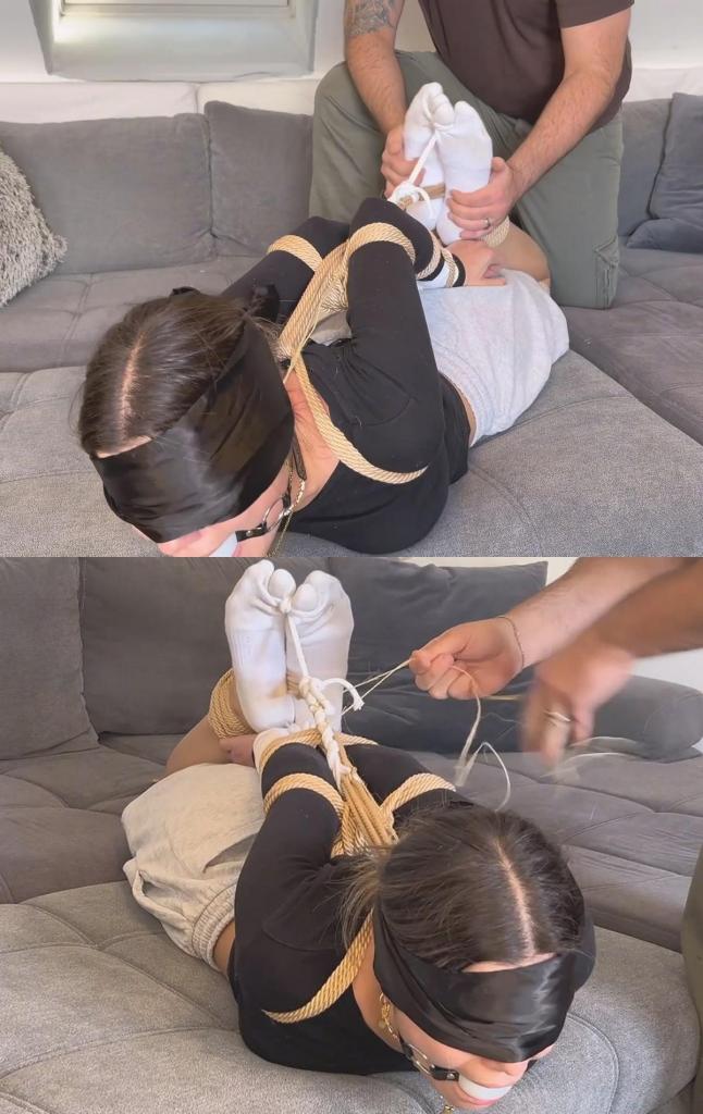 Strict hogtie in dirty white nike socks - tickle oder party 我们正在测试新买的棕色绳子。我被紧紧地捆绑成猪蹄状，穿着脏兮兮的白色耐克袜子。我的大脚趾也被粗暴地绑在绳子上。我的大球形口塞也被拉了下来。不仅如此，我还得忍受他用手、羽毛和画笔的末端挠我穿着袜子的痒。We are testing out our new brown ropes. I am bound tightly into a hogtie, wearing dirty white Nike socks. My big toes are brutally secured into the hogtie as well. My large ball gag is also pulled back. On top of that, I have to endure him tickling my sock-clad his hands, a feather, and the end of a paintbrush.
