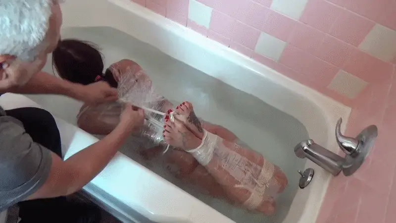 Sarah Tub Lover There isn't much that Sarah Brooke loves more then a nice relaxing evening in a tub. Bound. Gagged. Water running. I mean just look at that face!!  I put a little twist on the bondage on this one. Plastic wrap OVER bondage looks amazing!!