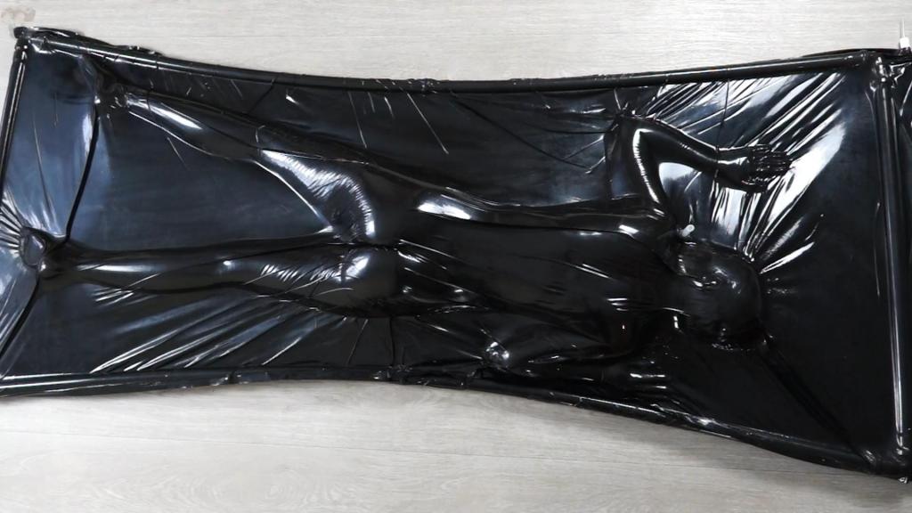 Girl with her butt up inside a black vacuum bed, part 2 The girl climbed into the vacuum bed and lay face down, so that her beautiful ass was covered with a black elastic material that looked like PVC. The girl tried to change position, but it was too late; the vacuum left no chance...