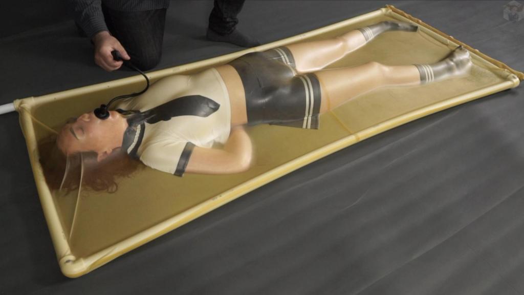 A girl in a school uniform is placed inside a vacuum bed, tickled and gagged with an inflatable gag Everyone dreams of tickling schoolgirl Sonya. So Bob didn't pass it by. He inflated the pear gag. The girl loved it. She laughed and delighted in stroking and pinching Bob. Her legs moved so sexily in the latex. Sonya enjoyed the feeling in the latex crib.