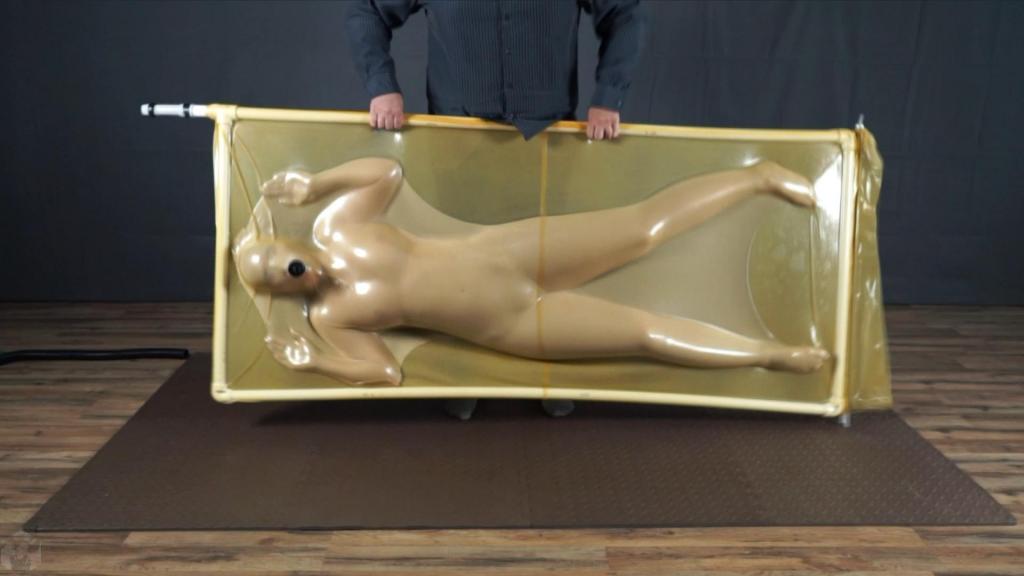 Girl inside nylon cocoon inside a latex bed Sonya felt like plunging into something soft and then into the latex vacuum bed. The girl thought, why not get involved with the nylon cocoon? It's so soft and nice to the touch. Sone couldn't pass by without feeling it in the latex vacuum bed.