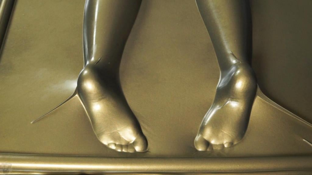 Beautiful female feet in a golden vacuum bed, spanking and tickling How do you like these beautiful female legs, feet, and soles? They're covered in gold latex, and the gold vacuum bed suits her perfectly. The spanking and tickling of these beautiful feet with a riding crop is mesmerizing...