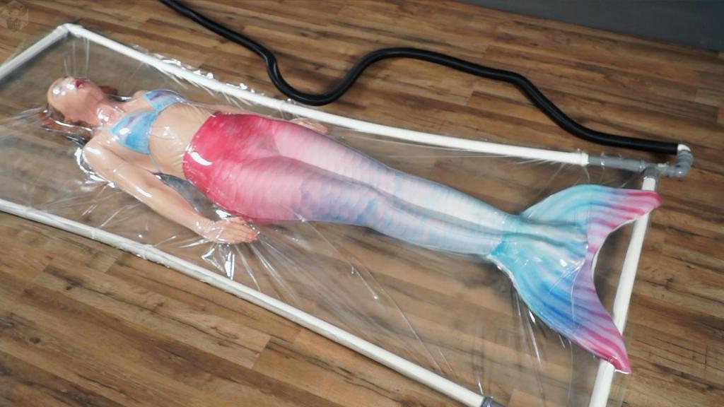 Mermaid in a vacuum bed Mr. Bob found a mermaid in the lake. She's very soundly. He thought, why don't she in a vacuum bed?