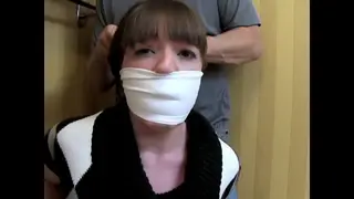 LIZ-He caught me trying to get out the door Liz Andrews<br><br> <br><br>A man ties Liz up in a hotel bathroom and leaves her struggling bound and gagged. Liz tries to get away by hopping to the door but is caught. Now he has her hogtied and gagged under the sink with her dress hiked up.