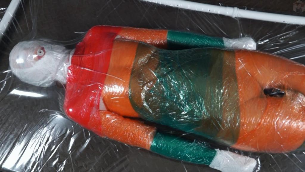 Mummification with multicolored stretch wrap in a transparent vacuum bed with vibro and orgasms The guys decided to use all the stretch wrap they had. Sonia tried on a new stretch wrap costume. She loves being in it. The mummification and vacuum went well. The girl didn't forget and put a new vibrator between her legs.
