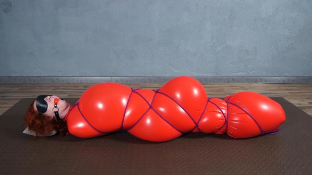 Rope Bondage in a red ball that turns into a inflatable cocoon You've seen the red inflatable bondage before. Now we decided to tie it with rope. Sonja was interested to try it with the gag and mask to feel the sensations better.