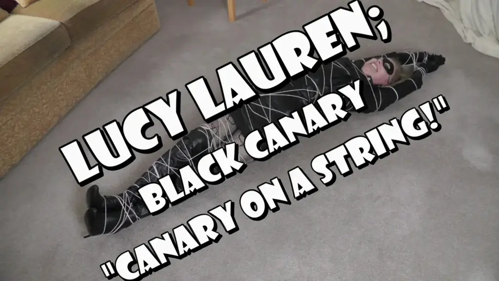 Lucy Lauren, Black Canary: Canary on a String Lucy Lauren is the luscious lady in leather, the Black Canary, and this time the virtuous vixen is on the trail of the notorious Colonel Kink, a particularly devious individual who just loves to tie up women!<br><br>Tracking the military miscreant to his secret hideout, the beautiful masked blonde walks into the room looking absolutely stunning in her black leather biker jacket, gloves, mini-skirt, thigh-high boots and fishnet stockings. Straight away she discovers an open laptop on a table in the corner of the room. This is exactly what the sexy superheroine was after - if she can find his secret files then she'll have enough on the colonel to put him behind bars for good!<br><br>Alas, it is a trap of course and unbeknownst to the delectable detective, the crafty colonel has crept into the room as Black Canary tries to open his secret files. Announcing his arrival with a loud cough, Black Canary spins round to see Colonel Kink in the flesh and immediately begins to use her supersonic scream to render him powerless. <br><br>But suddenly, the Colonel whips out some sort of electronic gizmo and activates it. In an instant, the surprised heroine starts to cough as her mighty Canary Cry is immediately neutralised by this strange device. <br><br>"Wh... what have you done?!" she splutters as once again she tries to use her special powers but despite still being able to speak, the stunned superheroine is horrified to discover she no longer can summon up her almighty Canary Cry!!!<br><br>With her superpower gone, the costumed crimefighter is at the mercy of the devilish Colonel Kink who captures her with ease... what now for the defeated do-gooder?!?<br><br>A short while later, Black Canary awakens to find herself lying on the floor of Colonel Kink's hideout and quickly discovers she is bound head to toe in a thin, tight string. Normally, the courageous crimefighter would have no problem breaking out of such feeble bindings but this is no ordinary thread...<br><br>After helplessly struggling for a while, her captor walks in and starts to gloat over his prized possession. The devious Colonel explains to Black Canary that she has been tied with his fiendish Strange String, a particularly nasty invention that constricts whenever it heats up. As the captured crimefighter struggles in the tight bondage, her beautiful body starts to warm up and this, in turn, will cause the special fibres in the string to contract, squeezing into her until she cannot breathe!!!<br><br>"You fiend!" Canary cries but the craft Colonel merely laughs. Having robbed the helpless heroine of her superpowers he now intends to rob her of her life! Gagging the champion of justice with a cleave gag, the dastardly supervillain leaves Black Canary to contemplate her final fate... can it be true, is the luscious lady in leather really to be squeezed like a ripe orange?!?<br><br>Struggling courageously the helpless heroine soon realises that the dastardly Colonel Kink was telling the truth, this string is indeed terribly tight and is gradually getting tighter. Despite her best efforts, she cannot sXXXX the thin thread, nor can she wriggle free from the increasingly shrinking strands. <br><br>Feeling the string squeeze into her beautiful leather-clad body, the room is filled with the sounds of her grunts and groans, not to mention the sound of her leather clothing rubbing against the tight bonds. Black Canary is well and truly stuck with seemingly no chance of escape. <br><br>Attempting not to move, the defeated do-gooder soon realises that doesn't work either. Her body heat has already started the process of shrinking the strange string, although it has slowed its progress down a little. However, the superheroine knows she can't just lie there like a statue, if she's to escape from this fiendish trap then she'll have to struggle eventually - but struggling only makes the string get tighter!<br><br>Oh, what a conundrum for the Black Canary!!! How will she ever escape from Colonel Kink's fiendish trap???<br><br>Sometime later, the helpless heroine awakens to find herself completely wrapped head to toe in tight, inescapable black plastic wrap. The strong squeezing cling film sticks to her body and is held in place by several bindings of parcel tape that keep Black Canary perfectly packaged. <br><br>Her superpowers are still rendered obsolete thanks to a large red ball gag that stretches her luscious lips wide apart and muffles her moans effectively. Her arms, trapped by her sides are as useless to her as her other limbs, all encased in the tight, squeezing plastic wrap.<br><br>The room is filled with the sound of Black Canary's various grunts and groans as he rolls around on the floor, completely unable to get free. The sound of the squeaky wrap can also be heard as it rubs against her bound body. She struggles and squirms but it is no use, the parcel tape keeps the stuff stuck fast around her. She kicks her booted feet out, the stiletto heels waggling but she can't get any purchase there either. This truly is an inescapable trap for the helpless heroine! <br><br>Suddenly Colonel Kink enters the room and laughs at his powerless prisoner. Gloating over his trophy, he tramples her underneath one of his booted feet, putting it on her stomach and even over her face at one point to humiliate her further. <br><br>Lightly kicking her, the dastardly Colonel explains that Black Canary is to be transported overseas to an anonymous client who has bought the heroine - no doubt for nefarious reasons - and she is to be shipped out that very night!<br><br>Well at least she isn't being eliminated but it is of little comfort to the stunned superheroine who now knows she has only a few brief hours in which to escape or she faces an arduous ordeal. As Colonel Kink leaves her alone once more to arrange the transport, Black Canary tries one more time to desperately get loose from this diabolical trap. <br><br>If only she could somehow work that gag loose and use her special powers... then she'd make Colonel Kink pay for what he has done!!!