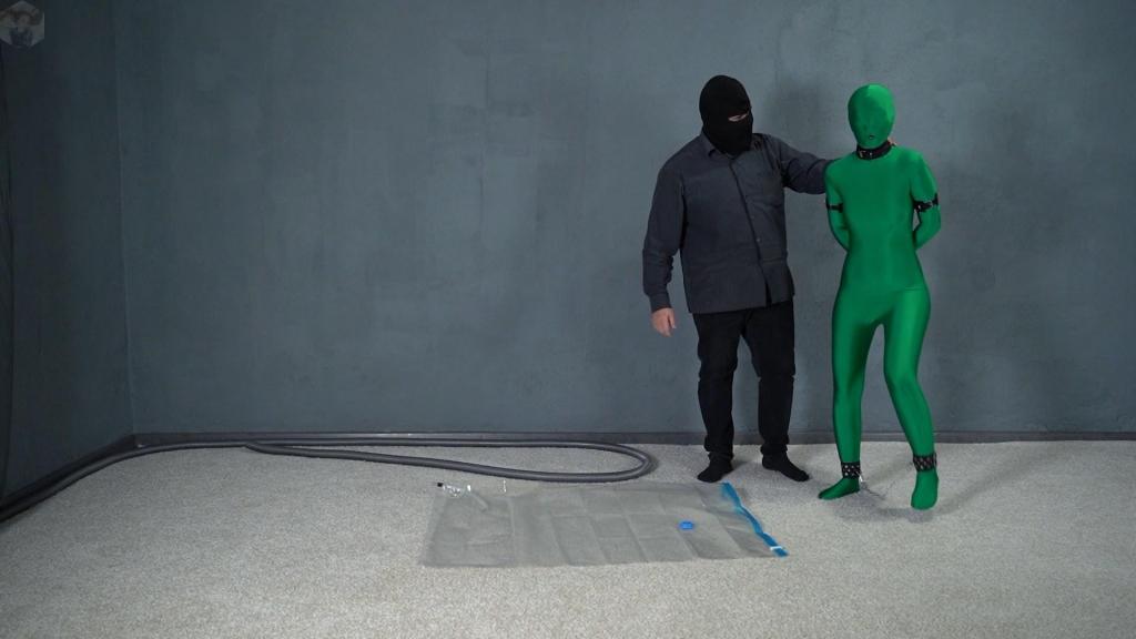 Bondage green zentai leather handcuffs in a vacuum bag Mr. Bob caught the green man after all and decided to have a little fun with him. He put leather handcuffs on him and put him in a vacuum bag.