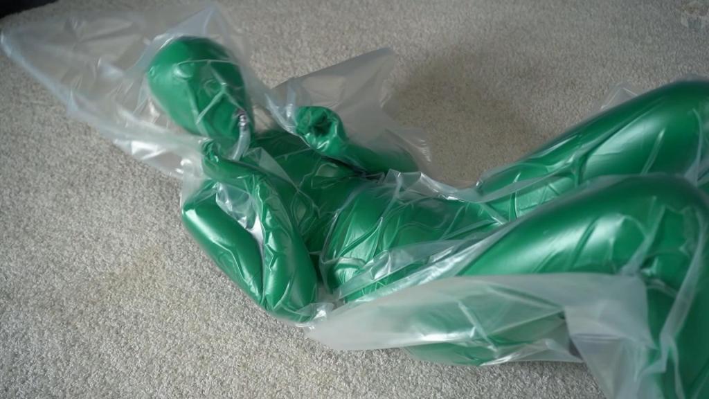 Zentai and the green man in the plastic trap You all remember the green man? He's still after Mr. Bob's documents and blueprints. Mr. Bob decided to have a little fun and set a trap for him.