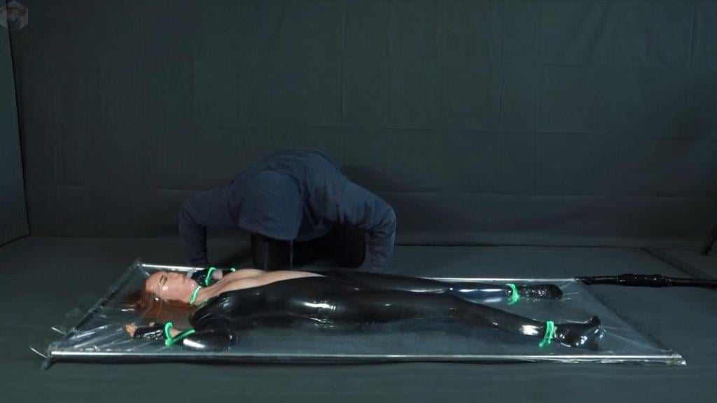 Super secret agent trapped by a hacker in a vacuum bed with a vibrator. The special agent tracked down the Hacker and found him in his bunker; he was working at his computer. She held him at gunpoint, but the Hacker had an ace up his sleeve: he incapacitated the agent with a stun gun and then placed her in a vacuum bed equipped with a vibrator. Orgasms racked the agent’s body all night and throughout the following day, until the vibrator finally ran out of power...