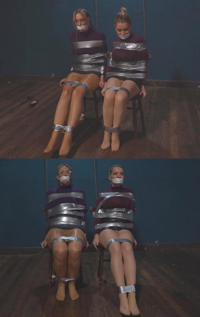 5282 Sloane and Layla in Chair Taped Snoopers 身为双胞胎的“窥探者”斯隆（Sloane）和莱拉（Layla）遭遇了同样的待遇——被胶带死死地绑在椅子上。<br><br>她们身穿短裙、连裤袜和高领T恤，身上被缠绕了层层叠叠的胶带。Twinned snoopers, Sloane and Layla, get the same treatment. Chairtaped.<br><br>Wearing short skirts, pantyhose and turtleneck tshirts, they get lots and lots of tape.