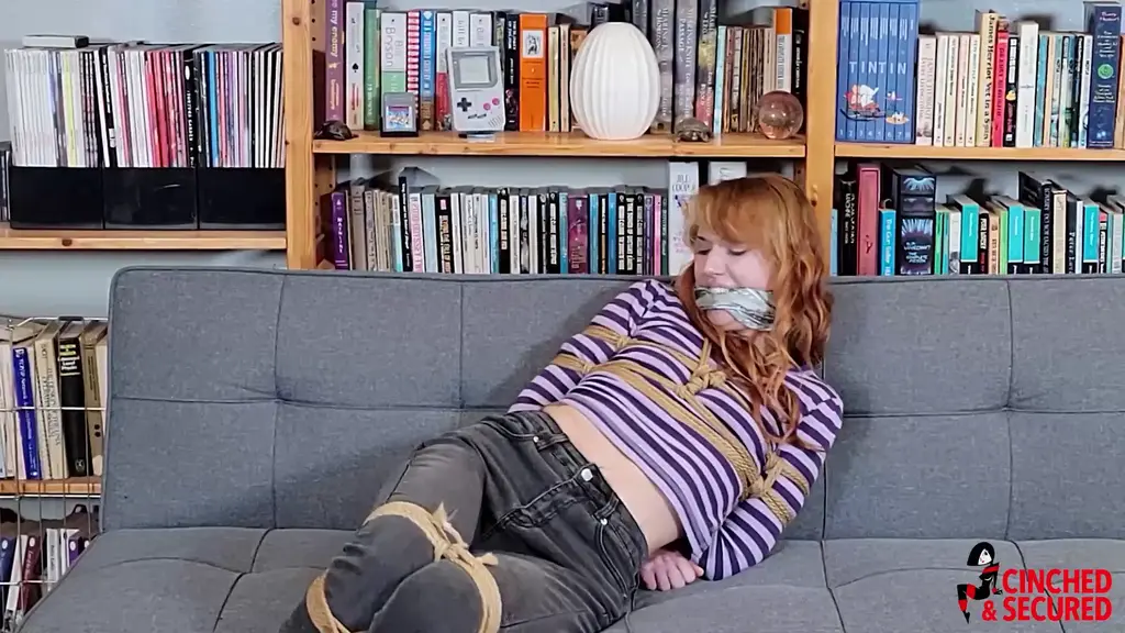 Cara Day - Tutor Tied and Gagged in Converse Shoes! Cara has been tutoring students at  her local university, and one has been having a particularly difficult time getting the hang of his lessons.  In desperation, Cara makes a deal: If he gets a passing grade, he can do anything he wants to her! She soon learns to regret that offer when the student passes and Cara finds herself tightly bound, cleave gagged and struggling under his lecherous gaze! She struggles for all she is worth, but only succeeds in eventually losing her Converse sneakers! Now thrashing and squirming in her socks, her feet slipping and sliding as she searches for purchase on the slick floor, she wonders what else the little brat has in store for her!<br><br>